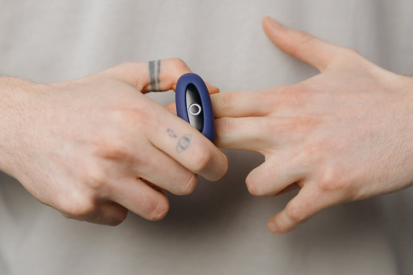 Blue silicone ring held in hands
