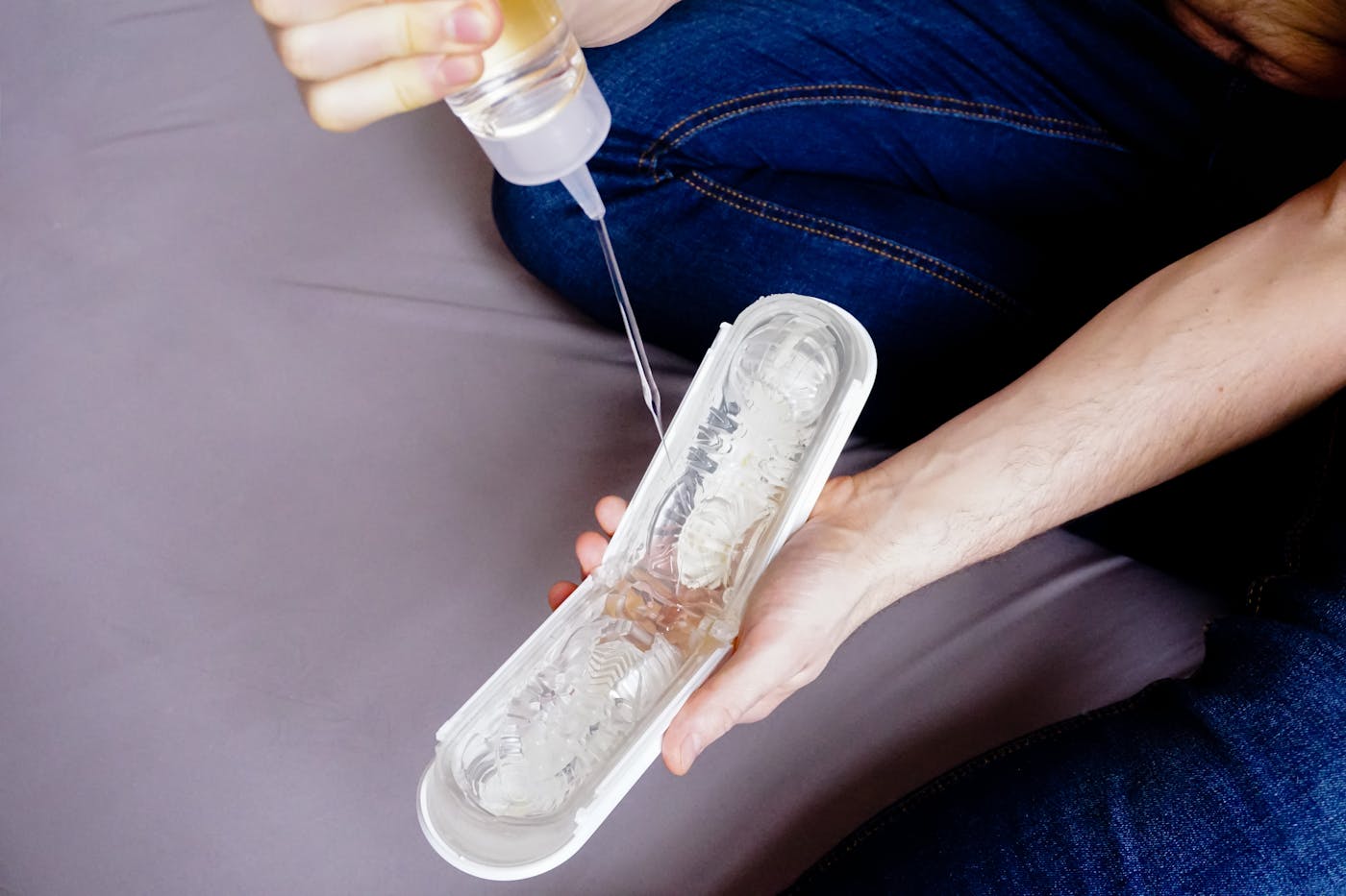 Purple adult toy held in a product-focused hand shot